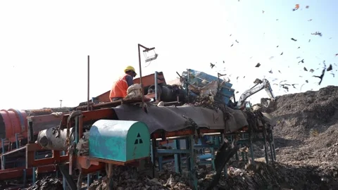 Worker Operating Waste Screening Machine On Delhi Landfill, India Stock Footage 248058594