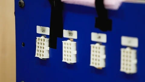 A worker operating a wire testing machine at a stock-wire factory: hands Stock Footage 102464522
