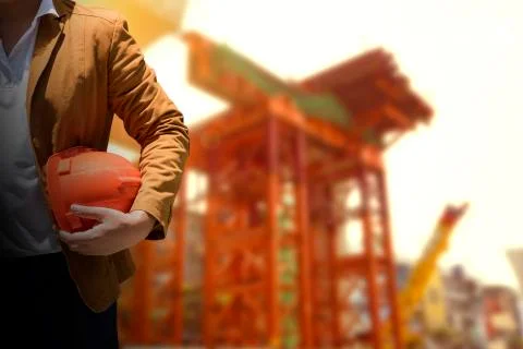 Worker or engineer holding in hands helmet for workers security. Foto stock