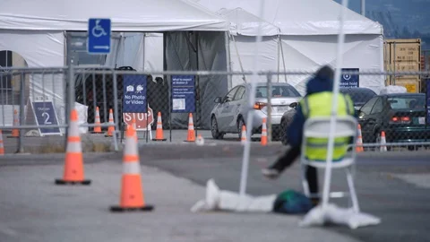 Worker oversees covid test site Stock Footage 129523529