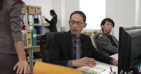 Worker overwhelmed by a stack of more paperwork Stock Footage 225598365