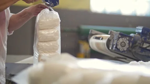 Worker packing crystal sugar at the sugar refinery Stock Footage 87868584
