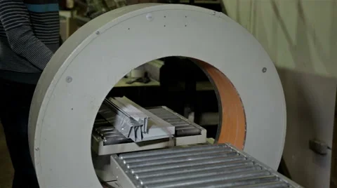 Worker packs in polyethylene some production Stock Footage 65286201