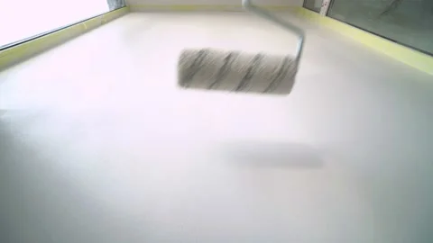 Worker Painter Paints the Wall with a Roller in Light tones Stock Footage 125713863