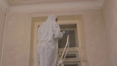 Worker painter prepares window to paint masking tape 스톡 동영상 148397981
