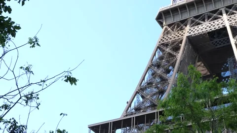 Worker painting the Eiffel Tower on a sunny day Stock Footage 196697084