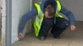 Worker painting external wall HD Footage