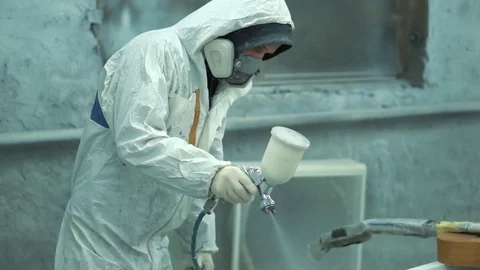 Worker is painting with a sprayer Stock Footage 74021435