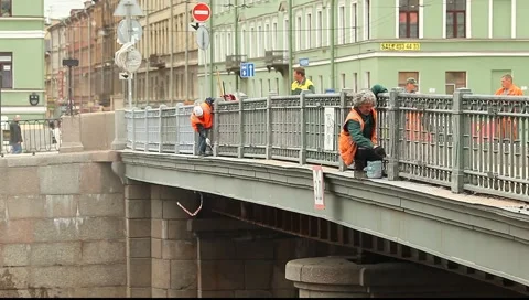 Worker paints the railing of the bridge Stock Footage 5108189