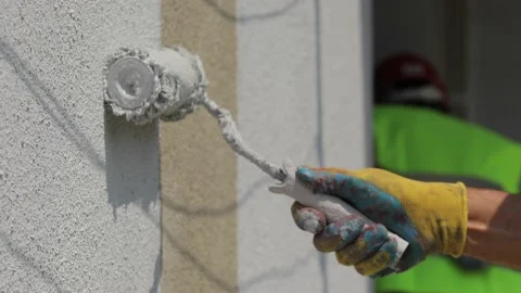 Worker paints the wall. White paint. Stock Footage 162655111