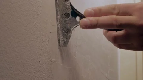 The worker peels off the paint. close up Stock Footage 146062732