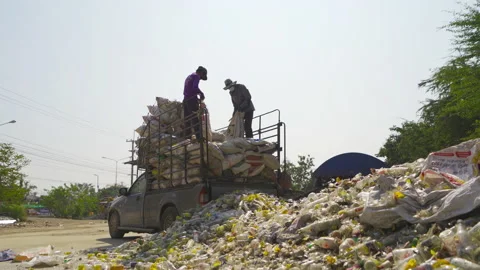 Worker people working on stack of different types of large garbage dump, plas 動画素材 168278413