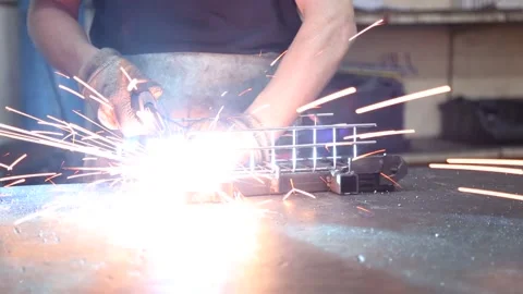 Worker Performing Arc Welding. Close-Up Bright Welding Sparks. Stock Footage 340109130