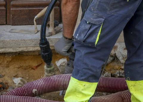 Worker performing outdoor maintenance Stock-Fotos