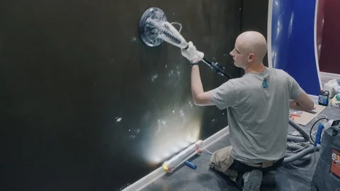 Worker performs apartment renovation using grinding tool Stock Footage 124003331