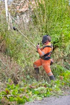 A worker performs brush cleaning tasks Stock Photos