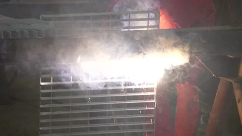 A worker performs welding work in a factory Stock Footage 252000064