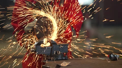 A worker performs welding work in a factory Stock Footage 252000293