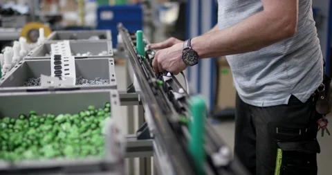 Worker Picking Green Plastic Parts, Assembly Station Factory, Medium Shot Stock Footage 340363698