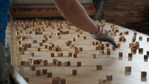 Worker picks a small Wood Cubes out of line, 4k, Slow motion 스톡 동영상 120996722