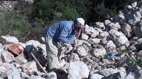 Worker pitching stones Stock Footage 36190834