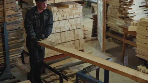 Worker Places Wooden Plank On Processing Workbench In Production Workshop Stock Footage 201062827