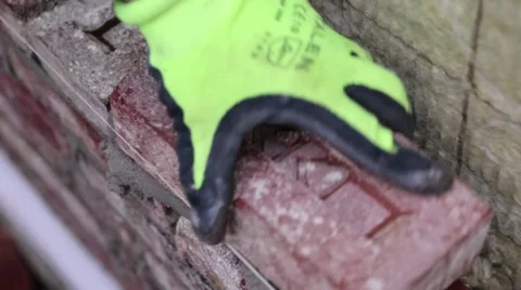 Worker placing a brick on a wall Stock Footage 60443120