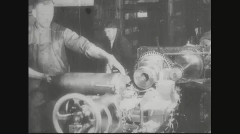 Worker placing the missile shell in lathe machine Stock Footage 43312223