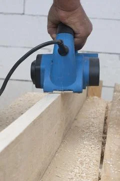 Worker is planing boards Stock Photos