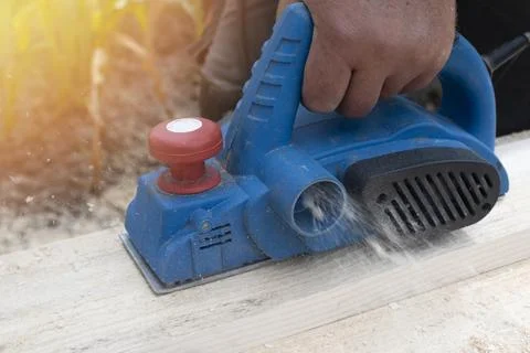 Worker is planing boards Stock Photos