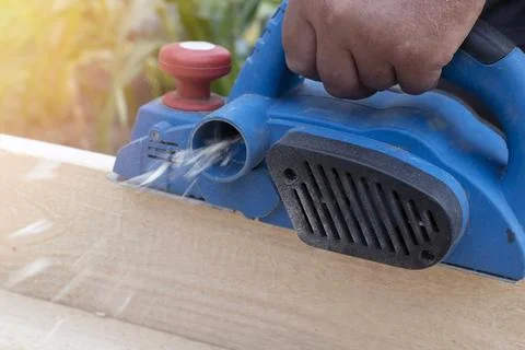 Worker is planing boards Stock Photos