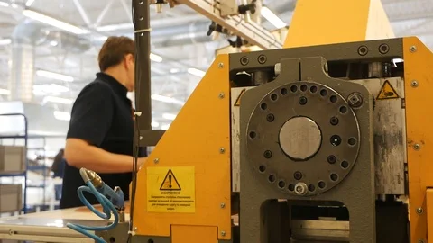 A worker of the plant is working on equipment Stock-Footage 90740154