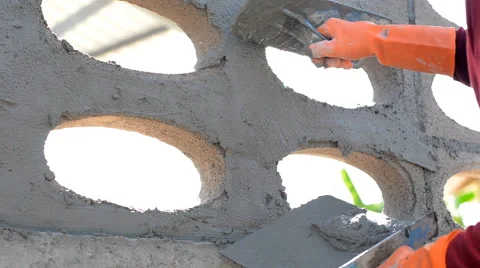 Worker plastering concrete at wall Stock Footage 51518496