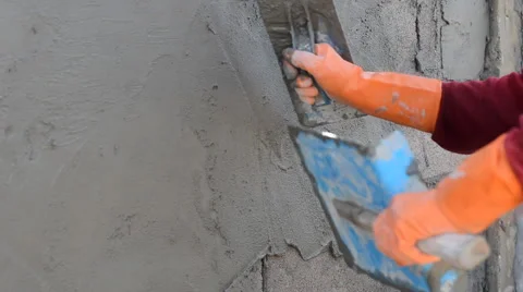 Worker plastering concrete at wall Stock Footage 51531994