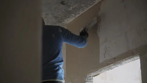 Worker Plastering a Concrete Wall Surface Stock Footage 302065960