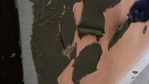 Worker plastering the facade of the building, close-up Stock Footage 73790537