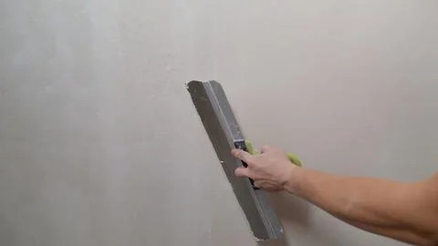 Worker Plastering Wall with Spatula Stock Photos