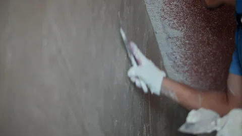 Worker plastering wall with trowel Stock Footage 317562202