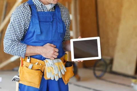 Worker pointing at tablet Stock Photos