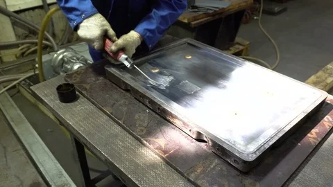 Worker polishes a metal surface Stock Footage 76900976