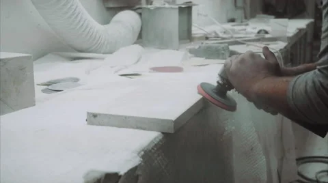 Worker polishes the piece of marble stone with tools 스톡 동영상 68075313