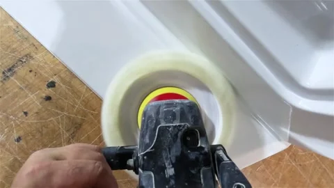 Worker Polishing Plastic Boat Component in Manufacturing Workshop Video stock 336530989
