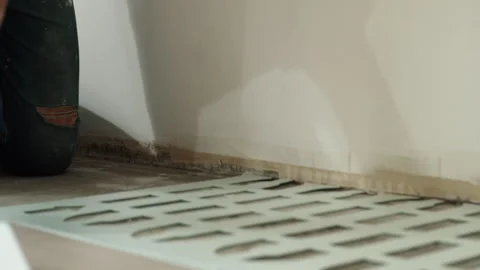 Worker Positioning Foam Underlayment Sheet Near Wall Stock Footage 322055040