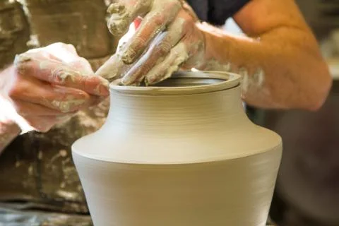 Worker potter in the workshop sculpting ceramic vase. 스톡 사진