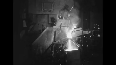 Worker pour molten metal in foundry - 1939 Stock Footage 103596595