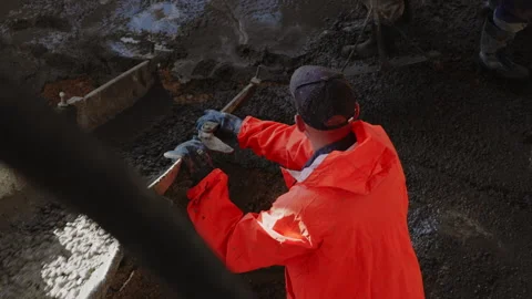 Worker pouring concrete at the construction site. Concrete unloading - close up Stock Footage 170721209
