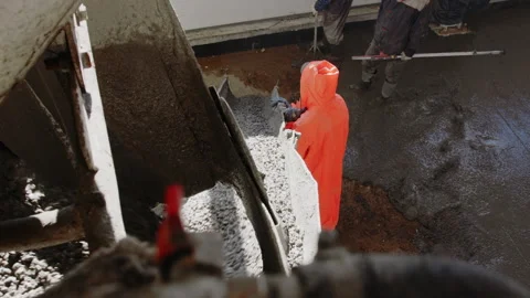 Worker pouring concrete at the construction site. Concrete unloading - close up Stock Footage 170998630