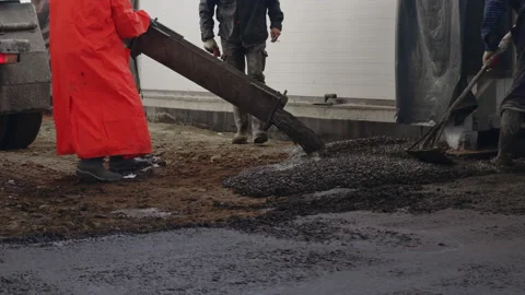 Worker pouring concrete at the construction site. Concrete unloading - close up Stock Footage 170998740