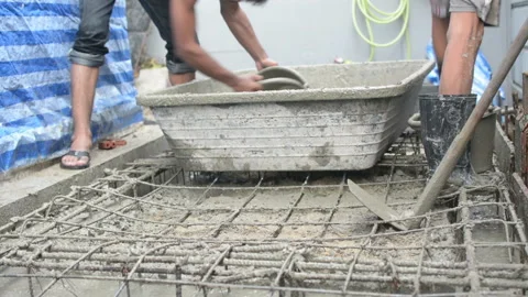 Worker pouring concrete works at construction site Stock Footage 137818009