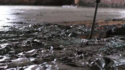 Worker pouring liquid monolithic foam concrete to wooden formwork Video stock 152568093